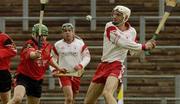 11 May 2003; Ryan Winters, Tyrone, is tackled by Down's Colin Murray. Guinness Ulster Junior Hurling Championship, Down v Tyrone, Casement Park, Belfast. Hurling. Picture credit; Pat Murphy / SPORTSFILE *EDI*