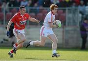 10 March 2013; Peter Harte, Tyrone, in action against Noel O'Leary, Cork. Allianz Football League, Division 1, Tyrone v Cork, Healy Park, Omagh, Co. Tyrone. Picture credit: Brian Lawless / SPORTSFILE