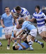 10 March 2013; Eric Olden, Blackrock College, goes over the challenge of Peter O'Briene and Harry Byrne, bottom, St. Michael's College. Powerade Leinster Schools Junior Cup, Semi-Final, St. Michael's College v Blackrock College, Donnybrook Stadium, Donnybrook, Dublin. Picture credit: Pat Murphy / SPORTSFILE