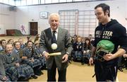 15 March 2013; Republic of Ireland manager Giovanni Trapattoni gets to grips with a hurl and sliotar during seachtain na gaeilge under the instruction of Dublin’s star forward Ryan O’Dwyer in Saint Macdara’s Community School, Templeogue. The Republic of Ireland squad will assemble in Malahide on Sunday March 17th ahead of their two FIFA World Cup Qualifiers against Sweden on Friday March 22nd in Friends Arena, Stockholm, followed by Austria on Tuesday March 26th in the Aviva Stadium, Dublin. St. Mac Dara’s Community College, Templeogue, Dublin. Picture credit: David Maher / SPORTSFILE