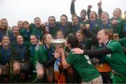 17 March 2013; Ireland's Niamh Briggs and Larissa Muldoon, 9, kiss the 6 Nations Trophy as their team-mates celebrate. Women's 6 Nations Rugby Championship, Italy v Ireland, Parabiago, Milan, Italy. Picture credit: Matt Browne / SPORTSFILE