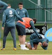 19 March 2013; Republic of Ireland's Jonathan Walters lies on the ground after a tackle by Shane Long, second from right, during squad training ahead of their side's 2014 FIFA World Cup, Group C, qualifier match against Sweden on Friday. Republic of Ireland Squad Training, Gannon Park, Malahide, Co. Dublin. Picture credit: David Maher / SPORTSFILE