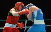 22 March 2013; Katie Taylor, Ireland, left, exchanges punches with Yulia Tsiplakova, Ukraine. Katie Taylor Fight Night, Bord Gais Energy Theatre, Grand Canal Square, Docklands, Dublin. Picture credit: Matt Browne / SPORTSFILE