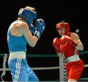 22 March 2013; Katie Taylor, Ireland, right, exchanges punches with Yulia Tsiplakova, Ukraine. Katie Taylor Fight Night, Bord Gais Energy Theatre, Grand Canal Square, Docklands, Dublin. Picture credit: Matt Browne / SPORTSFILE