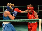 22 March 2013; Katie Taylor, Ireland, right, exchanges punches with Yulia Tsiplakova, Ukraine. Katie Taylor Fight Night, Bord Gais Energy Theatre, Grand Canal Square, Docklands, Dublin. Picture credit: Matt Browne / SPORTSFILE