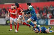 23 March 2013; Tommy O'Donnell, Munster, is tackled by George Naoupu, left, and Willie Faloon, Connacht. Celtic League 2012/13, Round 18, Munster v Connacht, Musgrave Park, Cork. Picture credit: Diarmuid Greene / SPORTSFILE