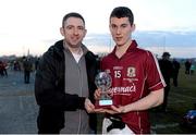 6 April 2013; Galway's Ian Burke receives the Cadbury Hero of the Match Award, from John Hennelly, Sales Representative, Cadbury Ireland, after the final of the Cadbury Connacht GAA Football Under 21 Championship which saw Galway named as the Connacht champions. Cadbury Connacht GAA Football Under 21 Championship Final, Roscommon v Galway, Dr Hyde Park, Roscommon. Picture credit: Stephen McCarthy / SPORTSFILE