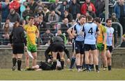 7 April 2013; Referee Padraig Hughes is attended to by Donegal Team Doctor Charlie McManus, and was subsequently carried off the pitch on a stretcher. Allianz Football League, Division 1, Donegal v Dublin, Páirc MacCumhaill, Ballybofey, Co. Donegal. Picture credit: Oliver McVeigh / SPORTSFILE