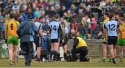 7 April 2013; Referee Padraig Hughes lies injured on the field in the second half. Allianz Football League, Division 1, Donegal v Dublin, Páirc MacCumhaill, Ballybofey, Co. Donegal. Picture credit: Oliver McVeigh / SPORTSFILE