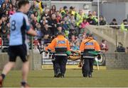 7 April 2013; Referee Padraig Hughes is carried off the pitch on a stretcher after receiving an injury in the second half. Allianz Football League, Division 1, Donegal v Dublin, Páirc MacCumhaill, Ballybofey, Co. Donegal. Picture credit: Oliver McVeigh / SPORTSFILE