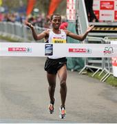 14 April 2013; Kenenisa Bekele, Ethiopia, crosses the finish line to win the SPAR Great Ireland Run 2013. Phoenix Park, Dublin. Picture credit: Pat Murphy / SPORTSFILE