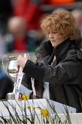 28 April 2013; Croke Park volunteer Mairead O'Carroll fixes the ribbons to the Allianz Football League Division 2 cup ahead of the game. Allianz Football League Division 2 Final, Derry v Westmeath, Croke Park, Dublin. Picture credit: Stephen McCarthy / SPORTSFILE