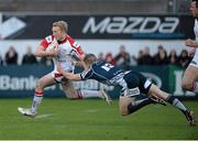 3 May 2013; Stuart Olding, Ulster, is tackled by Gavin Evans, Cardiff Blues. Celtic League 2012/13, Round 22, Ulster v Cardiff Blues, Ravenhill Park, Belfast, Co. Antrim. Picture credit: Oliver McVeigh / SPORTSFILE