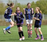 8 May 2013; Knockskeagh National School, Clonakilty, Co. Cork, players, from left to right, Claire Reilly, Lydia Jeffers, Moira Barrett and Ciara Barrett celebrate after their team won their semi-final match in a penalty shootout against Dromakeenan National School, Co. Tipperary, at the Aviva Health FAI Primary School 5's Munster Finals. Sean Choill All Weather, Corbally, Limerick. Picture credit: Matt Browne / SPORTSFILE