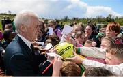 13 May 2013; Republic of Ireland manager Giovanni Trapattoni signs autographs on a visit to The Goal for Peace Programme. This is a novel programme run only in Leitrim bringing together children from Catholic and Protestant backgrounds from 10 schools in Leitrim and Fermanagh through the medium of soccer. This programme has been so successful that a follow up programme is now starting with a further 10 schools participating in the Goal to Friendship programme. These programmes also receive funding through the International Fund for Ireland (IFI) and Peace III Partnership. The Community Soccer Programme also works to build the capacity of local clubs who have been instrumental in coach education, bringing local children into the club scene for a variety of programmes including the Football for All and Summer Soccer Schools. Leitrim Gaels Community Pitch, Leitrim Village, Co. Leitrim. Picture credit: Stephen McCarthy / SPORTSFILE