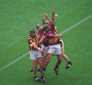 6 July 2003; Wexford pair Colm Kehoe (green helmet) and Keith Rossiter in action against Kilkenny's Eddie Brennan and Tommy Walsh, hidden. Guinness Leinster Senior Hurling Championship Final, Kilkenny v Wexford, Croke Park, Dublin. Picture credit; Ray McManus/ SPORTSFILE