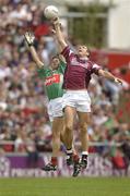 6 July 2003; Kevin Walsh, Galway, goes up for a high ball with Mayo's James Gill. Bank of Ireland Connacht Senior Football Championship Final, Galway v Mayo, Pearse Stadium, Galway. Picture credit; Damien Eagers / SPORTSFILE *EDI*