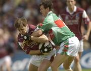6 July 2003; Matthew Clancy, Galway, in action against Mayo's Aidan Higgins. Bank of Ireland Connacht Senior Football Championship Final, Galway v Mayo, Pearse Stadium, Galway. Picture credit; Damien Eagers / SPORTSFILE *EDI*