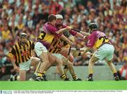 6 July 2003; Conor Phelan, Kilkenny, in action against Wexford's Barry Goff, left and Chris McGrath, right. Guinness Leinster Senior Hurling Championship Final, Kilkenny v Wexford, Croke Park, Dublin. Picture credit; Ray McManus / SPORTSFILE