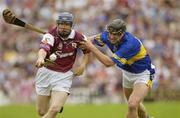 13 July 2003; Damien Hayes, Galway, in action against Tipperary's Martin Maher. Guinness Senior Hurling Championship Qualifier, Galway v Tipperary, Pearse Stadium, Galway. Picture credit; Ray McManus / SPORTSFILE *EDI*