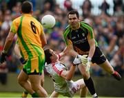 26 May 2013; The Donegal goalkeeper, Paul Durcan, under pressure from Tyrone's Colm Canavan, passes to team-mate Karl Lacey late in the game.  Ulster GAA Football Senior Championship, Quarter-Final, Donegal v Tyrone, MacCumhaill Park, Ballybofey, Co. Donegal. Picture credit: Ray McManus / SPORTSFILE