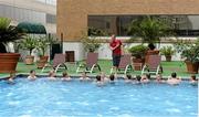 2 June 2013; Ireland strength & conditioning coach Jason Cowman with squad members during a pool recovery session in Houston ahead of their game against the USA on Saturday next. Ireland Rugby Summer Tour 2013. Houston, Texas, USA. Picture credit: Brendan Moran / SPORTSFILE