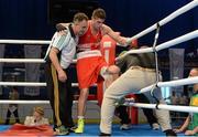 3 June 2013; Joe Ward, Ireland, is led from the ring by team coach Billy Walsh, left, after receiving an injury during his 81kg Light Heavyweight bout against Mateusz Tryc, Poland. EUBC European Men's Boxing Championships 2013, Minsk, Belarus. Photo by Sportsfile