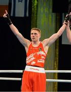 4 June 2013; Jason Quigley, Ireland, is declared the winner over Arbi Chakaev, Austria, after their 75kg Middleweight bout. EUBC European Men's Boxing Championships 2013, Minsk, Belarus. Photo by Sportsfile