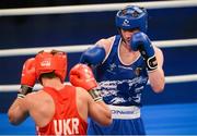 4 June 2013; Adam Nolan, right, Ireland, exchanges punches with Bogdan Shelestyuk, Ukraine, during their 69kg Welterweight bout. EUBC European Men's Boxing Championships 2013, Minsk, Belarus. Photo by Sportsfile