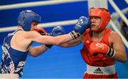 4 June 2013; Adam Nolan, left, Ireland, exchanges punches with Bogdan Shelestyuk, Ukraine, during their 69kg Welterweight bout. EUBC European Men's Boxing Championships 2013, Minsk, Belarus. Photo by Sportsfile