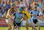 8 June 2013; Conor McCormack, Dublin, is tackled by Tomas Waters, left, and Eoin Moore, Wexford. Leinster GAA Hurling Senior Championship Quarter-Final, Wexford v Dublin, Wexford Park, Wexford. Picture credit: Matt Browne / SPORTSFILE