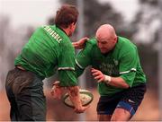 15 February 2000; Brian O'Driscoll gets the ball away to Keith Wood, Irish Rugby team pictured during training in Dr. Hickey Park, Greystones. Picture credit; Matt Browne/SPORTSFILE