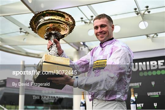 11 March 2025: Winning jockey Lorcan Williams celebrates after winning the Unibet Champion Hurdle with Golden Ace on day one of the Cheltenham Racing Festival at Prestbury Park in Cheltenham, England. Photo by David Fitzgerald/Sportsfile